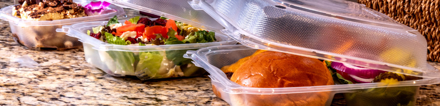 clear hinged containers with meals inside