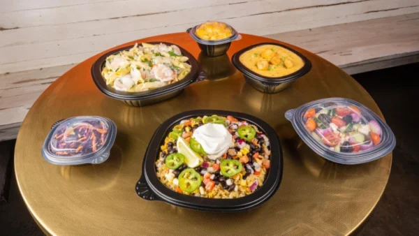 Grab-a-Bowl containers on table with food