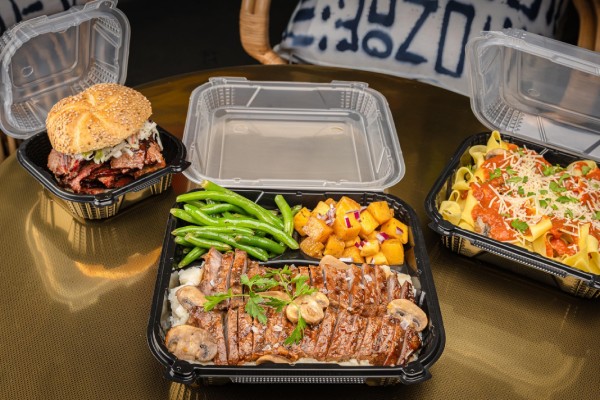 hinged food containers on table at restaurant